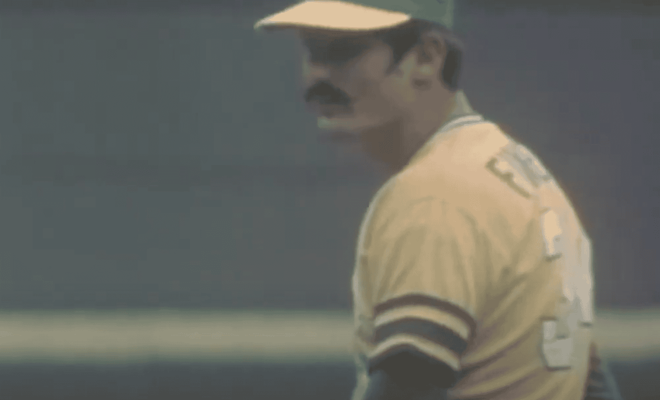 Image of Rollie Fingers showcasing his iconic mustache and pitching form, representing his role as a top closer.